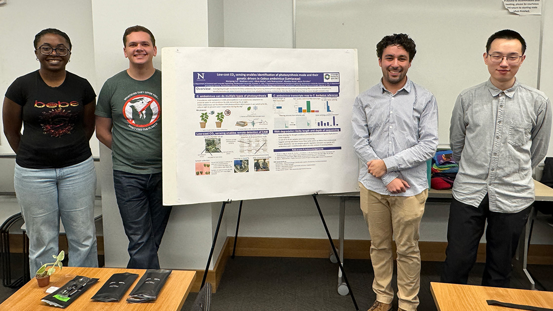 The project team presenting a poster on low-cost CO₂ sensing and C3-to-CAM photosynthesis in Coleus amboinicus